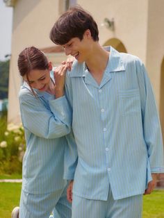 The Siena Long Sleeve Pajama Set features a classic blue background with vertical green stripes in a unisex design, crafted from 100% polyester with a comfortable, non-clingy fit. The set includes practical side pockets on the pants and comes in sizes M, L, and XL, with a relaxed silhouette that works well for both men and women. The wrinkle-resistant, easy-care fabric offers medium thickness and softness, making it ideal for comfortable lounging while requiring gentle hand washing at 30° to mai Casual Long Sleeve Home Sets, Summer Sleepover Long Sleeve Sets, Casual Long Sleeve Blue Sleepwear, Casual Blue Long Sleeve Sleepwear, Blue Long Sleeve Casual Sleepwear, Long Sleeve Summer Sleepwear For Bedtime, Blue Long Sleeve Sleepwear For Lounging, Long Sleeve Summer Sleepwear, Summer Sleepwear With Long Sleeves