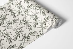 an olive branch wrapping paper on a white background