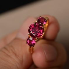 This is a gorgeous handmade creation. Its beauty is its simplicity & Elegance. The 8*8 mm round cut ruby(about 2.60 ct) is crafted in solid sterling silver or 14k white/rose/yellow gold All item is sent in a beautiful gift box If you have any idea of design your ring,pls contact me directly. You can realize more lovely stuff clicking the link https://www.etsy.com/shop/knightjewelry?refshopsection_shophome_leftnav Please leave the correct address and you phone number for delivering successful Ruby Rings With Accent Stones And Round Band, Formal Ruby Birthstone Ring, Ruby Rings With Accent Stones In Round Band, Formal Ruby Cluster Ring, Brilliant Round Cut Lab-created Ruby Jewelry, Red Pink Sapphire Rings, Ruby Rings With Round Cut And Prong Setting, Ruby Rings With Brilliant Cut For Gift, Fine Jewelry Garnet Birthstone Ring