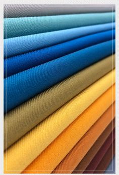 an image of the colors of fabrics in different shades and sizes, including blue, yellow, green, red, orange