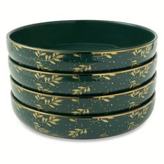 four green bowls with gold leaf designs on the rims and one bowl is empty