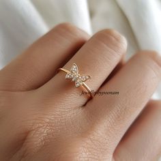 Detail: 925 Sterling Silver CZ Butterfly Ring, Dainty Pave CZ  Butterfly Ring, Diamond Butterfly Ring, CZ Butterfly lovers Ring,Butterfly Ring 💜Item Name: diamond butterfly ring  💜Metal : 925 sterling silver  💜Gemstone:cubic zirconia 💜Ring Size : All Standrd ring size available Custom Option:  Yes 💜jewellrybypoonam💜 This exquisite 14k yellow gold moissanite diamond ring is the perfect symbol of your love and comtmitment. Designed with a timeless elegance, this ring is sure to take her brea Sparkling Stackable Rings Gift, Fine Jewelry Stackable Sparkling Rings, Fine Jewelry Sparkling Stackable Rings As Gift, Sparkling Fine Jewelry Stackable Rings As Gift, Sparkling Fine Jewelry Stackable Rings For Gifts, Anniversary Fine Jewelry Midi Rings With Cubic Zirconia, Stackable Rings With Sparkling Stones For Gift, Dainty Cubic Zirconia Midi Rings For Anniversary, Dazzling Rings With Sparkling Stones As Gift