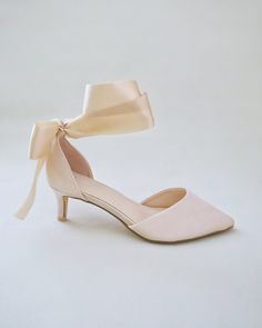 Classic satin pointy toe low heel shoes adorned adorned with matching satin or sheer ribbons that ties to an oversized bow around ankle to add elegant grace to any ensemble. Simple and easy wear for bridal wear, bridesmaids, holiday party, wedding parties, and any special occasions. DETAILS: HEELS: 2 inches UPPER: Synthetic upper and lining MATERIALS: Manmade outsole ORIGIN: Imported Spring Ribbon Heels With Closed Toe, Spring Heels With Satin Bow And Ankle Tie, Spring Ankle Tie Heels With Satin Bow, Chic Kitten Heels With Bow And Ankle Strap, Spring Ankle Strap Kitten Heels With Bow, Spring Wedding Heels With Satin Bow, Feminine Satin Pointed Toe Heels, Low Heel Heels With Satin Bow For Spring, Summer Wedding Shoes With Satin Bow And Low Heel