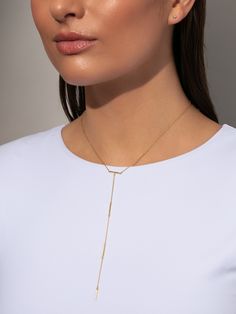 Take your necklace stack to the next level with this 18k gold over sterling silver Y-shaped necklace. Our Levels Vermeil Lariat Necklace combines gold bar details with a chain necklace to create the ultimate layering piece. For a stack you’ll want to wear every day, layer this gold lariat necklace with our Twist Chain Vermeil Necklace. | 18k Gold Levels Vermeil Bar and Chain Lariat Drop Necklace | Women's Jewelry by Uncommon James Minimalist 14k Yellow Gold Lariat Necklace, Modern Gold Lariat Necklace With Adjustable Chain, Elegant Yellow Gold Lariat Necklace For Layering, Chic Yellow Gold Lariat Necklace With Clavicle Chain, 14k Gold Lariat Necklace With Delicate Chain, Minimalist Lariat Necklace With Satellite Chain, Chic Gold Lariat Necklace For Everyday Wear, Yellow Gold Lariat Necklace For Layering, Modern Gold Lariat Necklace With Long Drop