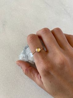 Natural rose cut 6mm crystal quartz takes a center stage in this delicate and minimal ring. Available in sterling silver, gold filled and solid 14k gold. The crystal is clear and faceted (rose cut). Solid gold sales are final. Thank you! * Featured ring-1mm gold filled, size 7 Dainty Initial Ring With Round Band, Dainty Crystal Round Cut Promise Ring, Dainty Crystal Promise Ring With Round Cut, Dainty Initial Ring As Promise Ring, Dainty Initial Ring For Promise, Dainty Tiny Initial Ring, Dainty Stackable Rings For Everyday, Dainty Everyday Stackable Rings With Round Cut, Dainty Gold Moonstone Ring For Everyday