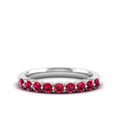 Introducing our exquisite diamond and ruby wedding ring, a symbol of eternal love and commitment. Crafted with precision and elegance, this stunning piece features a row of sparkling diamonds and vibrant rubies set in a sleek band of your choice. The combination of the brilliant diamonds and rich red rubies creates a captivating contrast, making this ring a true statement of sophistication and romance. Metal: 14K Gold Setting Type: Prong Rhodium Finish: Yes, on White Gold Gemstone Details: Gemst Ruby Diamond Ring With Half Eternity Round Band, Ruby Half Eternity Ring With Diamond In Round Band, Ruby Jewelry With Half Eternity Round Band, Ruby Half Eternity Round Band Jewelry, Red Ruby Ring With Single Cut Diamonds For Wedding, Red Wedding Rings With Single Cut Diamonds, Red Single Cut Diamond Wedding Rings, Channel Set Ruby Jewelry For Wedding, Wedding Ruby Ring In White Gold With Half Eternity