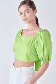 Looking for a top that's feminine and fashion-forward? Look no further. This top features a square neckline, short puff sleeves and cropped length. Plus, the adjustable back tie closure ensures a perfect fit. Whether you're dressing up or dressing down, this top is sure to become a wardrobe favorite. Square neckline Short puff sleeves Cropped length Adjustable back tie closure Hand wash cold Do not bleach Do not tumble dry Iron low Shell: 56% Polyester 44% Viscose Lining 1: 100% Cotton Lining 2: 100% Rayon JJ1471T Total length : 15.50" Bust:33" S Height 5.10"(178cm) / Bust 32"(81cm) / Waist 25"(67cm) / Hip 35"(89cm) Chic Green Square Neck Top, Trendy Green Square Neck Top, Fitted Green Puff Sleeve Top, Fitted Green Top With Square Neck, Green Fitted Top With Square Neck, Green Fitted Square Neck Top, Chic Green Puff Sleeve Fitted Top, Chic Fitted Green Puff Sleeve Top, Chic Green Fitted Puff Sleeve Top