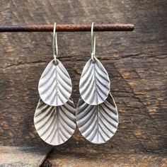 Leaf dangle drop Hilltribe silver earrings Approximate dimensions ; L 56mm x W 29mm Thai Karen Hill Tribe Silver contains 97-99% pure silver - higher than sterling silver's 92.5%. Higher silver content results in natural, lustrous texture and color. High-content silver is softer and easier to shape into beautiful, ornate styles. Using methods that have been passed down for generations, each piece has been individually handcrafted by skilled craftsmen from the native Karen Hill Tribe of Northern Bohemian Silver Drop Jewelry, Silver Teardrop Earrings With Oxidized Finish As Gift, Oxidized Silver Long Drop Jewelry, Silver Long Drop Earrings With Oxidized Finish, Silver Oxidized Long Drop Jewelry, Silver Long Drop Jewelry With Oxidized Finish, Hypoallergenic Sterling Silver Leaf-shaped Earrings, Silver Leaf-shaped Jewelry With Ear Wire, Nickel Free Leaf-shaped Sterling Silver Earrings