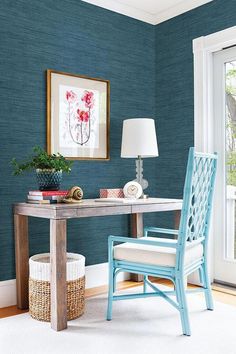 a chair and table in a room with blue walls