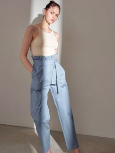 Long 100% cotton trousers. High waisted with ruffle and belt. Model is in MINUSEY ONE SIZE. Please allow 5-12 days shipping when in restocking. * MINUSEY ONE SIZE = EU 34-38, US 2-6* 100% Cotton* Dry clean* Made in Korea - Model Height: 170cm/5'7" (US2, EU34) Spring High-waisted Pants With Belt Detail, Spring Trousers With Belt Detail, High Waist Pants With Belt Detail For Summer, Straight Pants With Belt Detail For Spring, Chic Cotton Bottoms With Belt Detail, Chic Paperbag Waist Bottoms With Belt Detail, Chic Bottoms With Belt Detail And Paperbag Waist, Spring Straight Leg Bottoms With Belt Detail, Spring Straight Pants With Belt Detail