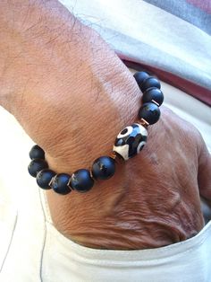 Men's Spiritual Courage, Fortune, Protection Bracelet with Tibetan Eye Fire Agate, Matte Onyx, Hematites - Yoga - Bohemian Man Bracelet by tocijewelry on Etsy Artisan Hand Wrapped Black Bracelets, Artisan Hand Wrapped Black Bracelet, Artisan Hand-wrapped Black Bracelet, Artisan Black Bracelet For Gift, Black Agate Bohemian Bracelets, Bohemian Black Agate Bracelets, Bohemian Man, Unique Mens Bracelet, Time To Hunt