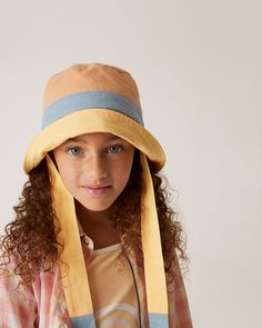 A trip to the beach isn't complete without the final touch of a our Singing Beach Hat. This piece comes complete with a wide brim and ties, making it fit for a day under the sun.100% CottonMade in Portugal Fun Adjustable Wide Brim Hats, Fun Wide Brim Adjustable Hats, Playful Adjustable Straw Hat For Spring, Playful Sun Hat With Curved Brim For Vacation, Adjustable Fit Beach Bucket Sun Hat, Fun Adjustable Vacation Hats, Playful Adjustable Wide Brim Straw Hat, Fun Adjustable Fit Hats For Vacation, Playful Curved Brim Hat For Vacation