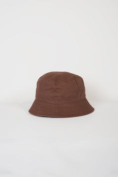 100% Cotton Foldable One size fits all Classic Brown Bucket Hat, Classic Brown Bucket Hat With Short Brim, Casual Solid Brimmed Bucket Hat, Casual Solid Color Brimmed Bucket Hat, Outdoor Brown Cotton Bucket Hat, Casual Sun Hat, One Size Fits Most, Vintage Brown Hat For Everyday, Casual Sun Hat One Size Fits Most, Casual Solid Color Sun Hat One Size