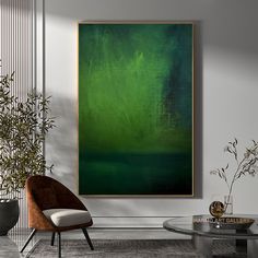 an abstract painting hangs on the wall above a glass table in a modern living room