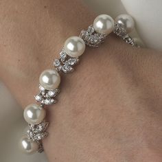 Affordable Elegance Bridal - Exquisite Ivory Pearl and CZ Bridal Wedding Bracelet, $79.99 (http://www.affordableelegancebridal.com/exquisite-ivory-pearl-and-cz-bridal-wedding-bracelet/) Wedding Jewelry With Pearl And Diamond Accents, Elegant Diamond White Bracelets For Wedding, Elegant Diamond White Bracelet For Wedding, Elegant Diamond White Wedding Bracelet, Pearl Drop Bracelet For Wedding, White Pearl Embellished Bracelets For Wedding, White Crystal Pearl Bracelet For Formal Occasions, White Pearl Diamond Bracelet For Anniversary, Wedding Bracelet With Pearl Drop