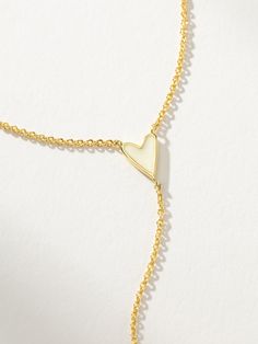 We took two of your favorite styles and combined them to create the Amour Lariat Necklace. This long chain necklace features a white enamel heart, making it the perfect match to the rest of our white heart styles. Complete your look with pieces from our Hearts Collection. | Gold Dainty Amour Lariat Drop Necklace with White Pendant | Women's Jewelry by Uncommon James White Heart Pendant Necklace With Clavicle Chain, White Heart Pendant Clavicle Chain Jewelry, White Sterling Silver Heart Necklace With Clavicle Chain, White Heart Pendant Clavicle Chain, White Heart Pendant Necklace With Delicate Chain, White Lariat Necklace As Gift, White Jewelry With Adjustable Chain For Valentine's Day, White Minimalist Jewelry With Heart Charm, Minimalist White Necklace For Valentine's Day