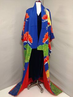 "Authentic vintage Japanese Uchikake wedding kimono coat purchased in Japan in the 50's. Gorgeous traditional robe - worn like a coat (no obi). Padded hem and furisode sleeves. Very elaborate hand painted and embroidered design, especially dramatic on the gold thread cranes. Includes applique work and alot of handwork. Bright, colorful, and festive. Vibrant peacock blue base color. Overall condition very good, looks never worn but has some fading from storage - please see close up and full robe Ceremonial Vintage Kimono, Vintage Red Kimono For Wedding, Vintage Long Kimono For Wedding, Vintage Wedding Kimono With Kimono Sleeves, Blue Bohemian Kimono For Wedding, Bohemian Blue Kimono For Wedding, Antique Wedding Gown, Wedding Coat, Applique Work