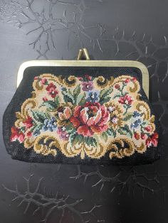 an embroidered purse with flowers on it