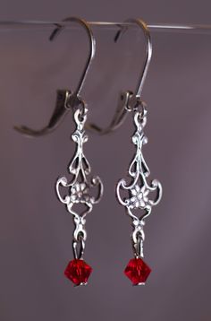 Victorian style earrings with 4 mm Swarovski Red crystals. The Earring are 1 1/2 inches long. Red Teardrop Crystal Earrings, Red Chandelier Earrings For Formal Events, Elegant Red Teardrop Earrings With Ear Wire, Formal Red Chandelier Earrings, Red Crystal Drop Earrings For Pierced Ears, Red Teardrop Earrings For Formal Occasions, Elegant Red Crystal Earrings, Red Teardrop Chandelier Earrings As Gift, Classic Dangle Earrings For Valentine's Day