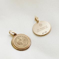 Inspired by vintage coin necklaces, the Sunburst Crest Necklace can be worn layered or alone as a chic statement. Pendant size: 15mm x 15mm x 1.2mm Bail Size: 3mm x 6.6mm Available in Sterling Silver, Cavan Gold, and 14K Gold 14k Gold Coin Jewelry Stamped 14k, Commemorative Coin Pendant Medallion Jewelry, Commemorative Medallion Coin Pendant Jewelry, 14k Gold Coin Pendant Jewelry For Commemoration, 14k Gold Coin Jewelry For Commemoration, 14k Gold Jewelry With Coin Pendant And Round Disc, Vintage Charm Jewelry With Round Pendant For Commemoration, Vintage Charm Round Pendant Jewelry For Commemoration, 14k Gold Engraved Medallion Pendant Necklace