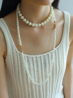 This elegant necklace showcases simplicity at its finest, featuring smooth white shell beads delicately strung together. The minimalist design exudes a timeless charm, perfect for both casual and formal occasions. With its versatile style, this necklace effortlessly complements any outfit, adding a touch of sophistication to your look. Metal: 18K Recycled Gold Plated On Brass Gemstone: Mother of Pearls(6.5mm/8mm/12mm) 6.5mm/8mm Bead Chain Length: 400mm 12mm Bead Chain Length: 390mm Weight: 26.5/ Classic White Necklace For Layering, Elegant Pearl White Beaded Necklace With Clavicle Chain, Elegant Pearl Necklace For Layering With Round Beads, Elegant Pearl Necklace For Layering, White Pearl Chain Necklace For Layering, White Pearl Necklace For Layering, White Pearl Layering Necklaces, White Single Strand Necklace For Layering, Timeless White Clavicle Chain Necklace