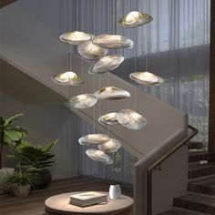 a stair case with several lights hanging from it