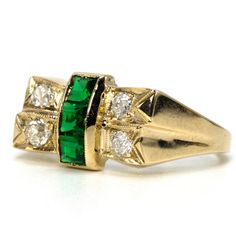 This lovely Retro ring holds three square cut lab grown emeralds in a central channel that's accented by four Old European Cut diamonds. The texture and design of the ring's top is reminiscent of a bow and speaks the industrial design language so identified with the 1940s. On the inside of the band is an engraving that reads "V.H. to A.H. 5-1-44." Metal: 10K Yellow GoldMain Stones: 3 Square Cut Emeralds (laboratory grown)Accent Stones: 4 European Cut Diamonds (approx. 0.30 carat total, E-F color Diamond And Emerald Ring, Retro Ring, European Cut Diamonds, Design Language, Square Cut, Emerald Ring, Industrial Design, Precious Metals, Lab Grown