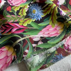 the fabric is very colorful and has flowers on it