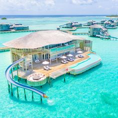 an aerial view of a resort in the ocean