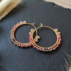 These small, beaded hoops were made with Miyuki glass beads in various light pink and purple shades. Miyuki beads are known for their high quality, uniformity, and vibrant colors. These hoop earrings are also available with other color gradients. In my shop Baffling Beads AT you can find a variety of beaded jewelry pieces - I focus on earrings, hair accessories such as woven beads and bracelets. All my handmade jewelry pieces were designed and crafted by me and are completely handmade. Ombre Palette, Colored Earrings, Purple Shades, Purple Ombre, Miyuki Beads, Wire Wrapped Earrings, Beaded Hoop Earrings, Beaded Hoops, Pink And Purple