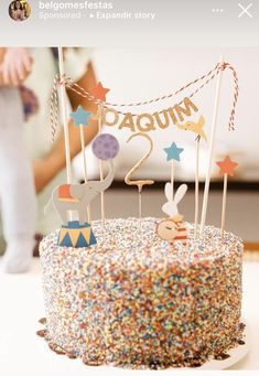 there is a cake with candles and decorations on the top that says daquinm