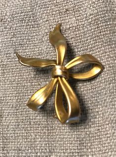 "14k(tested) brooch, Victorian Ribbon Bow brooch with hook on back to hand a watch, locket, charm etc.  The condition I see no problems, \"C\" ring clasp for pin stem.  Size approx. 1\" by 7/16\", wt. 2.8grams.  Easy to wear, very versatile." Yellow Gold Bow Jewelry For Formal Occasions, Formal 14k Gold Jewelry With Bow Detail, Victorian Gold Brooches For Formal Occasions, Gold Victorian Brooches For Formal Occasions, Vintage Jewelry With Decorative Bow As Gift, Heirloom Gold Brooches For Evening, Vintage Wedding Jewelry With Bow Detail, Heirloom Gold Evening Brooches, Gold Ribbon Jewelry For Formal Occasions