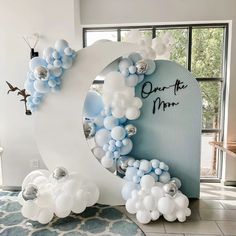 balloons are arranged around the letter o on display