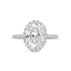 an oval cut diamond ring with pave set shoulders