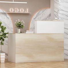 the front desk of a hotel with flowers in vases and a sign that says logo