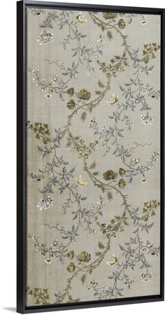 a wall hanging with flowers and leaves on it