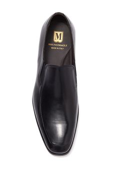 Buttery leather composes this slip-on pair of loafer dress shoes. Sizing: true to size. Moc toe. Slip-on style. Leather construction. Made in Italy Business Leather Slip-on Shoes With Rubber Sole, Semi-formal Slip-ons With Rubber Sole, Business Casual Slip-ons With Leather Lining, Business Almond Toe Slip-ons With Leather Lining, Slip-on Moc Toe Loafers For Office, Office Slip-ons With Rubber Sole, Office Slip-ons With Leather Lining And Plain Toe, Formal Almond Toe Slip-ons With Rubber Sole, Business Casual Slip-ons With Almond Toe And Stitched Sole