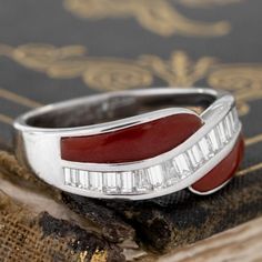 A most unique and incredibly charming twist motif band in red enamel and baguette cut diamonds! We're very into this band and its' charming details - that enamel is in excellent condition and adds a juicy pop of color to add to one's jewelry collection. The baguettes are bright and shimmery, making for a fun and easy band for daily wear. Platinum Size 6.75 & resizable with limitations Diamonds are estimated to be G/H colors & VVS/VS1 clarities. GIA Standards Please see qualitative report for mor Modern Mens Rings, Art Jewelry Earrings, All Band, Twisted Band, Antique Watches, Antique Engagement, Baguette Cut Diamond, Mens Band, Vintage Band