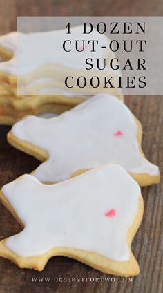 four dozen cut - out sugar cookies on a wooden table with text overlay that reads, 4 dozen cut - out sugar cookies