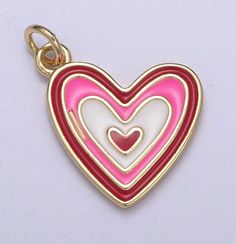 14k Gold Filled Pink Enamel Layer Heart Charm Colorful Love Pendant Size: 22m mx 16.6mm Gold Filled and enamel Charms can be added to our Charms Necklacesor purchase on their own to be worn with your necklace. all charms purchased individually are mounted on 5 mm 20g jump ring SKU: N-305-CL Gold Enamel Heart Necklace For Valentine's Day, Valentine's Day Gold Enamel Heart Necklace, Valentine's Day Heart-shaped Open Heart Charms, Valentine's Day Heart Charm, Valentine's Day Heart Charm Enamel Jewelry, Valentine's Day Enamel Heart Charm Jewelry, Pink Enamel Heart Pendant Jewelry, Pink Heart Charms For Mother's Day, Enamel Heart Charm Necklace For Valentine's Day