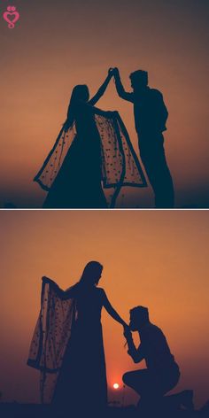 the silhouettes of two people holding hands in front of an orange and black sky