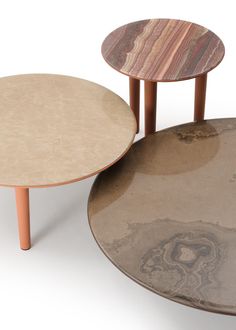 two tables with different shapes and sizes on each one, sitting next to each other