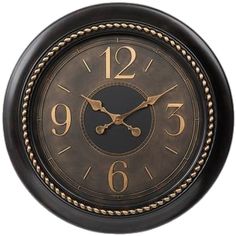 a black and gold clock with numbers on it's face is shown against a white background