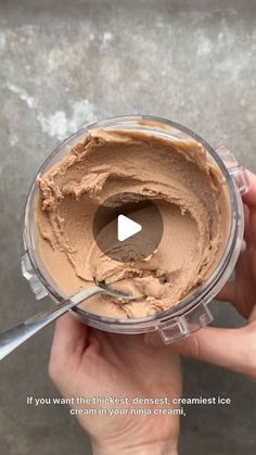 a person holding a cup with some kind of food in it and a video about how to make chocolate ice cream