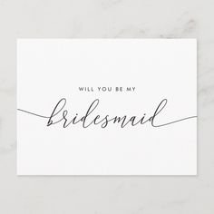 the will you be my bridesmaid card with black ink on white paper, sitting on a marble surface