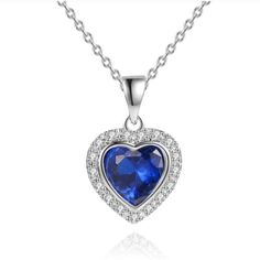 Made With Sleek 18k White Gold Plated Brass Featuring A Beautiful Created Crystal Or Opal Heart Pendant Decorated With Shimmering Cubic Zirconia Elements. Lobster Clasp. Cable Link Chain. 3 Carat Round Shaped Opal. Chain Length Is 18". Pendant Dimensions Are 1"(L) X 0.9"(W) Elegant Blue Heart Necklace, Formal Sapphire Heart Necklace, Formal Heart Necklace With Birthstone, Formal Heart Shaped Birthstone Necklace, Formal Heart-shaped Birthstone Necklace, Elegant Sapphire Heart Pendant Necklace, Elegant Sapphire Necklaces For Valentine's Day, Sapphire Heart Necklace, Pebble Necklace