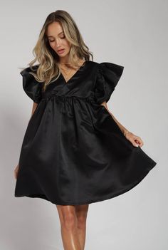 Okay so your holiday outfit just got cuter! Stepping that LBD game up with some ruffles and a little flare! Fits tts Chic Mini Length Dress-up Dresses, Cute V-neck Dress With Ruffle Hem, Spring Ruffle Dress With Ruffled Skirt For Dress-up, Fitted Ruffle Holiday Dress For Dress-up Events, Fitted Ruffle Holiday Dress For Dress-up, Cute Flowy Party Dress, Holiday Sleeveless Dress With Ruffles, Formal Fitted Ruffle Holiday Dress, Cute Flutter Sleeve Dress For Party