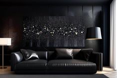 a living room with black leather furniture and a large painting on the wall behind it