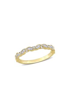 a yellow gold wedding band with diamonds