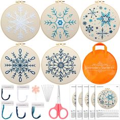 embroidery kit with snowflakes, scissors and other items to make an ornament